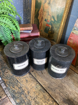 A set of three lidded wooden apothecary jars