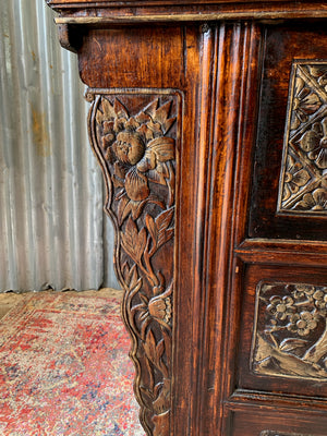 A carved wooden Chinese altar cabinet