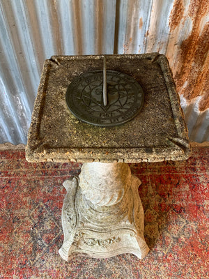 A large cast stone sundial