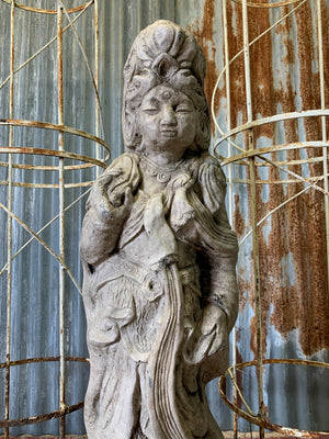 A cast stone garden statue of Guanyin