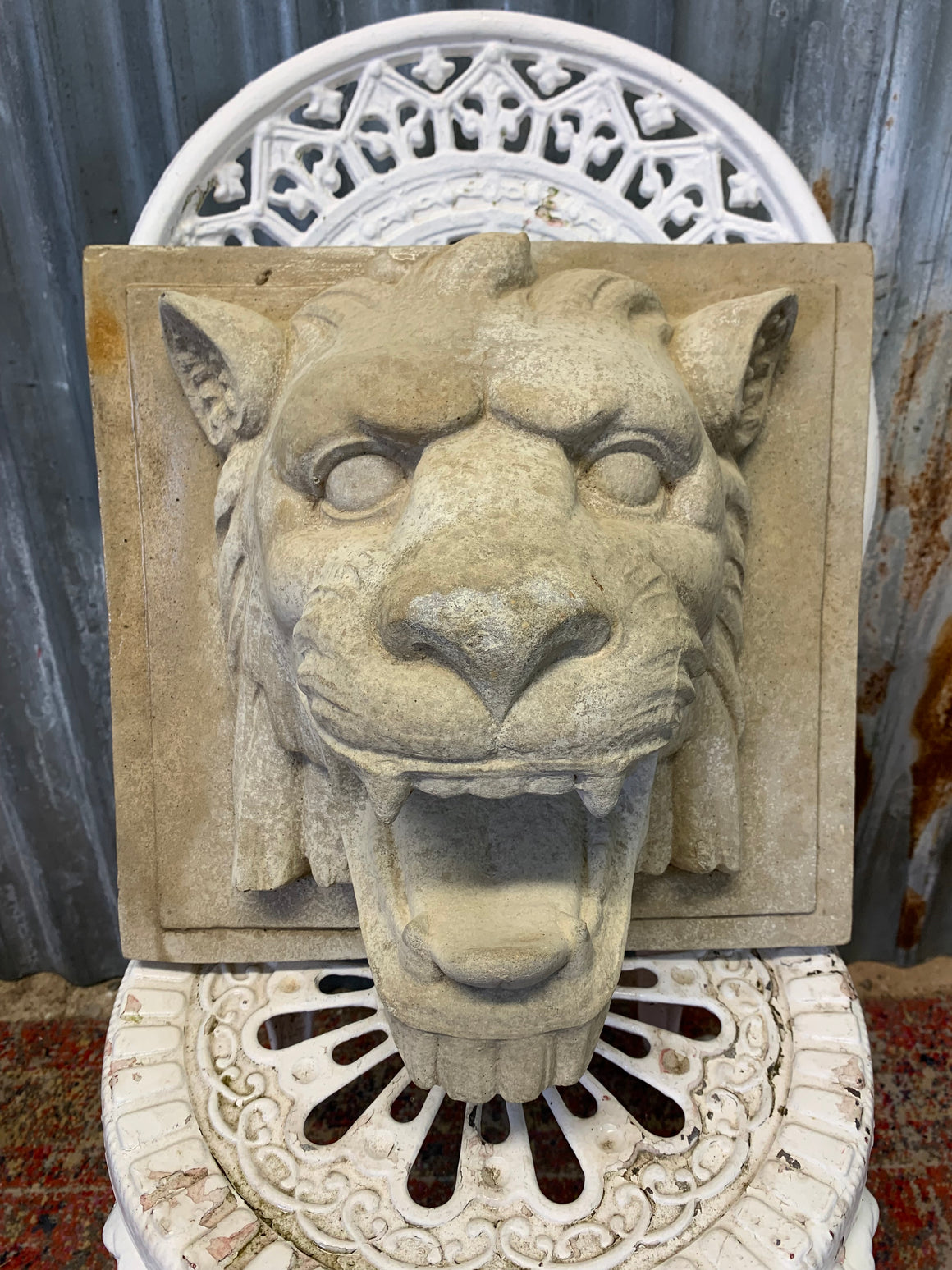 A cast stone roaring lion head fountain plaque - 37cm