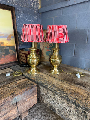 A pair of baluster form brass lamps