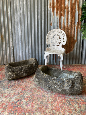 A pair of cast stone faux bois trough planters