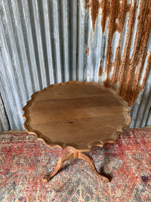 A Georgian style tilt top table with ball and claw feet