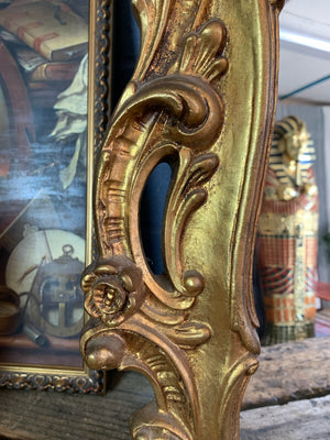 A large giltwood Rococo style mirror