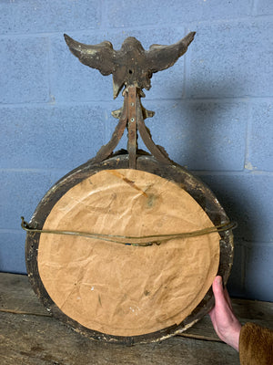 A large Regency style convex mirror with eagle surmount