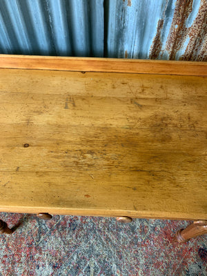 A pine two-drawer desk