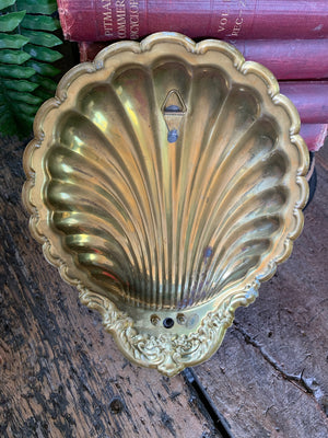 A pair of large brass shell candlestick wall sconces