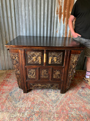 A carved wooden Chinese altar cabinet