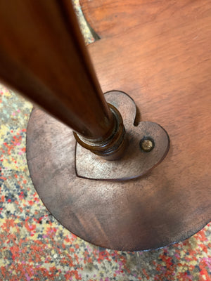 A carved mahogany occasional table with trefoil cloverleaf top