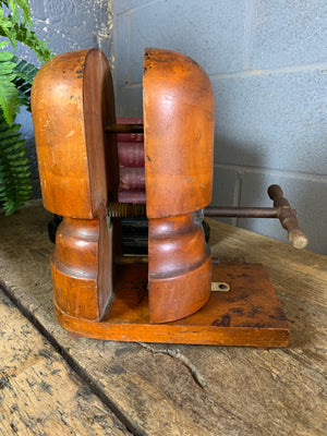 A wooden millinery hat stretcher