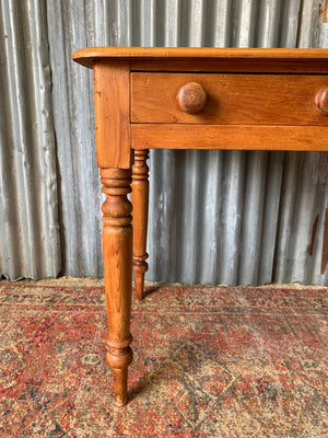 A pine two-drawer desk