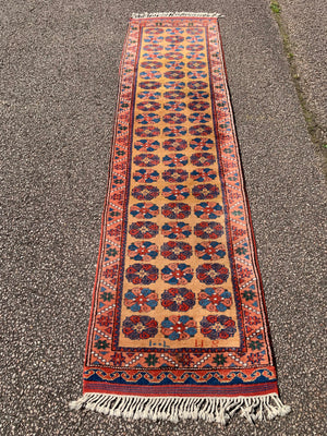 A long yellow ground red blue Persian runner rug ~ 257cm x 67cm