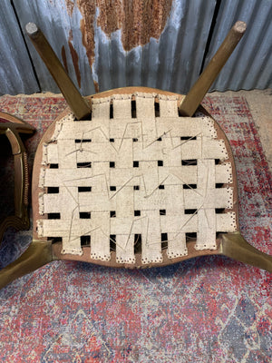 A pair of red damask giltwood open armchairs