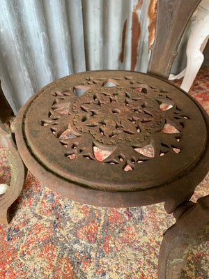 A cast iron Britannia garden table with marble top