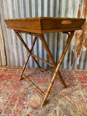 A faux bamboo butler's tray table