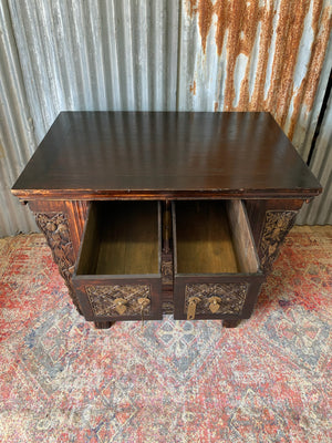 A carved wooden Chinese altar cabinet