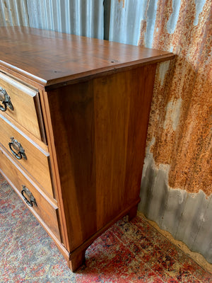 An Art Nouveau chest of drawers