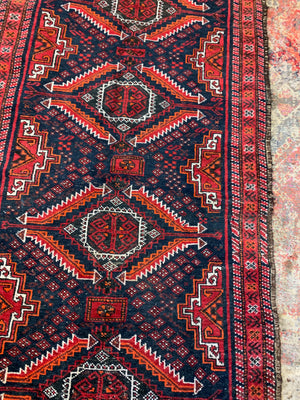 A Persian red & blue ground rectangular rug ~ 179cm x 96cm