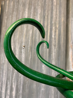 A tall bentwood coat stand with hat rack