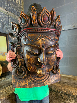 A very large hand-carved bodhisattva head