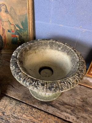 A pair of large cast stone gadrooned urns