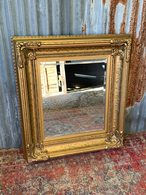 A large French style gilt mirror