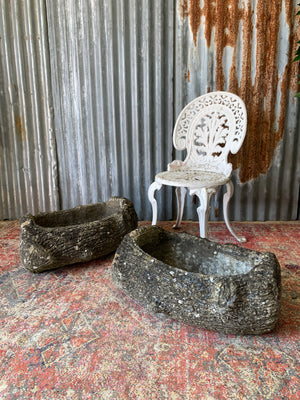 A pair of cast stone faux bois trough planters