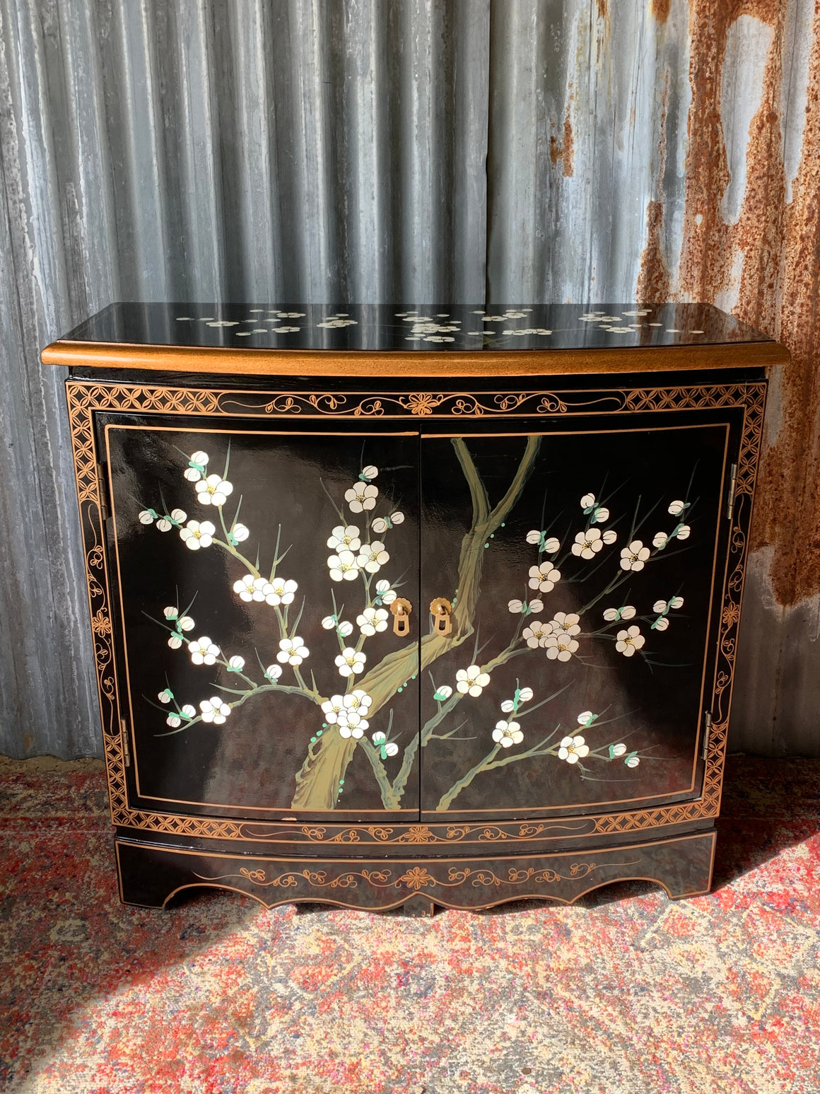 A black lacquered Chinoiserie cabinet