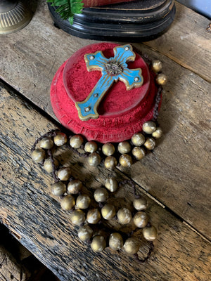 A set of oversized wooden rosary beads with eye motif