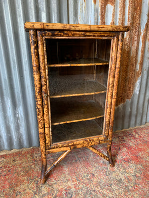 A tiger bamboo display cabinet