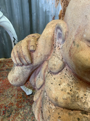 A large terracotta buddha statue