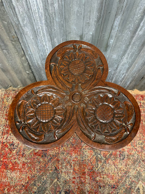 A carved mahogany occasional table with trefoil cloverleaf top