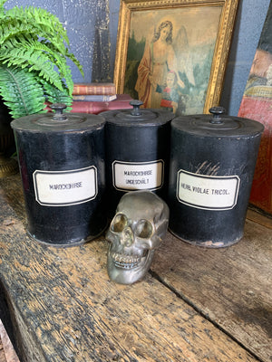 A set of three lidded wooden apothecary jars