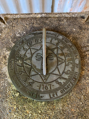 A large cast stone sundial