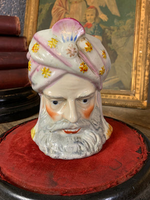 A ceramic tobacco jar in the form a Turk's head