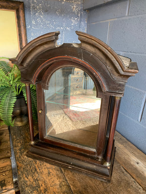 A grandfather clock case display cabinet