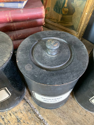 A set of three lidded wooden apothecary jars