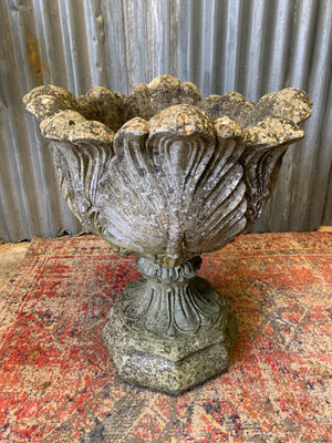 A pair of large acanthus cast stone urns