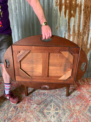 A mahogany butler's tray table