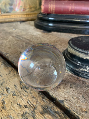 A Victorian crystal ball with box and stand