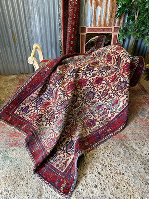 A red and cream ground Persian rug ~ 210cm x 163cm