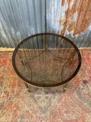 A rare circular brass and glass Hollywood Regency coffee table