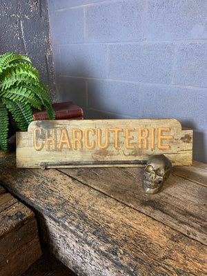 A French ‘charcuterie’ sign with hanging rack