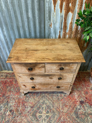 A pine chest of two over two drawers