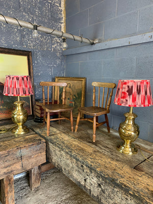 A pair of baluster form brass lamps