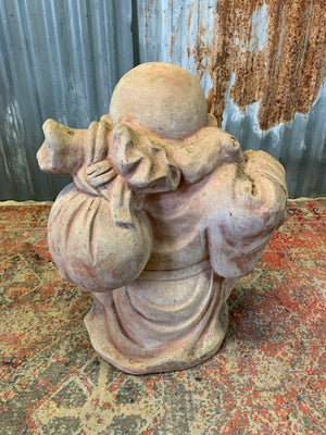 A large terracotta buddha statue