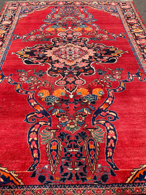 A very large rectangular red ground Persian floral rug ~ 12ft x 8ft