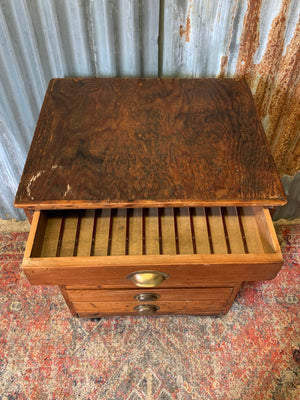 A pine chest of six drawers on castors