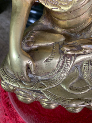 A bronze seated Buddha figure